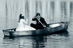 Bride and Groom Rowing in Boat