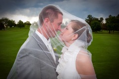 Bride and Groom Covered in Veil