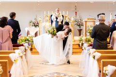 Wedding Couple Kissing near Altar