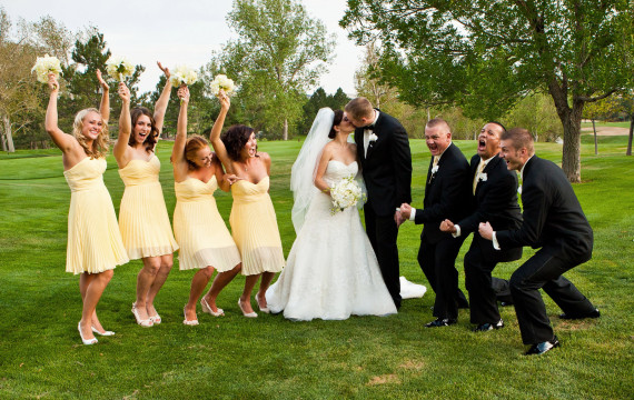 Bridal party having fun on wedding day