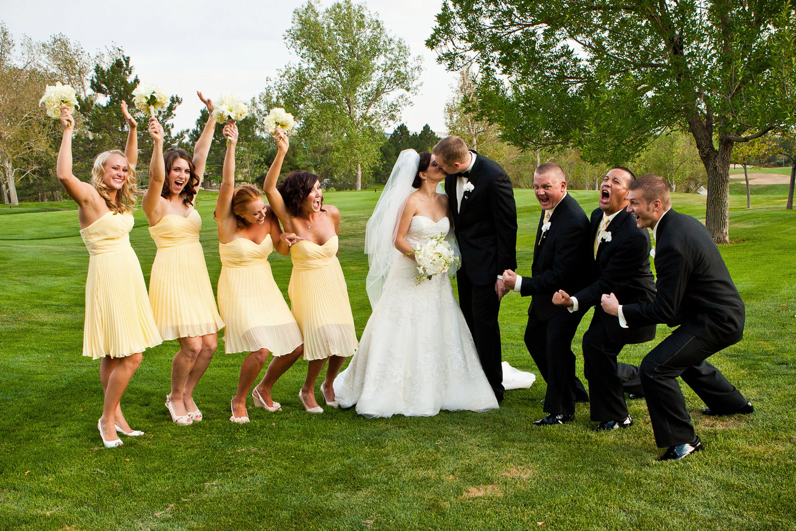 Bridal party having fun on wedding day