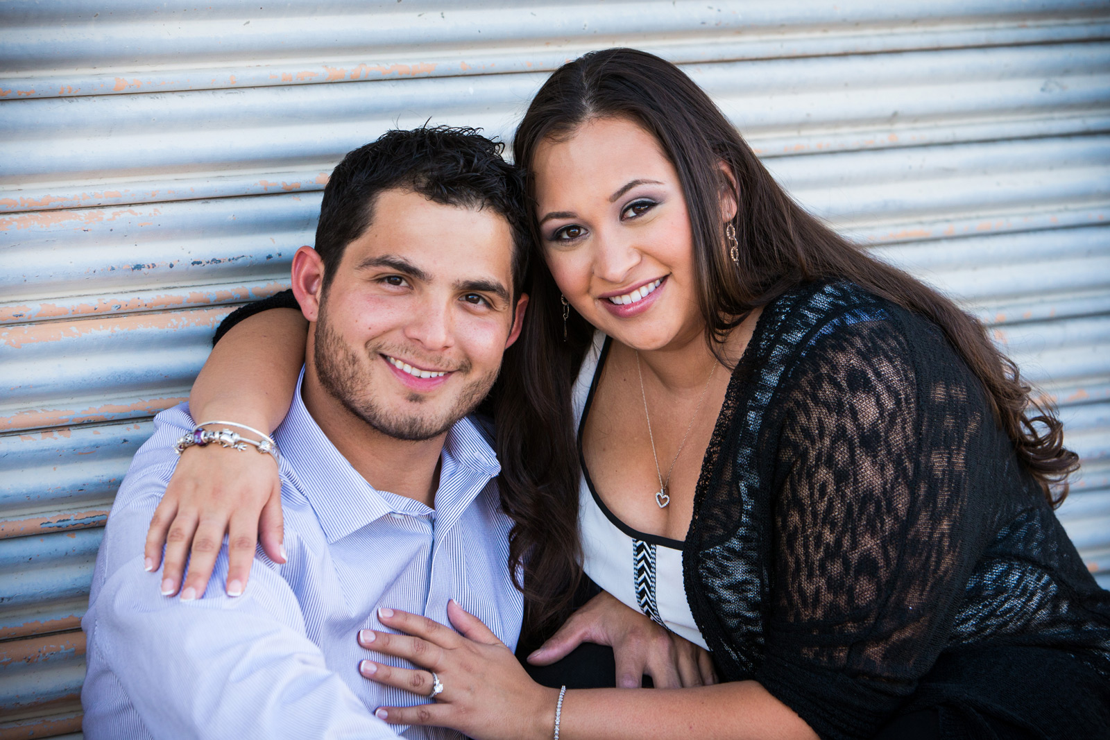 Engagement pose in alley