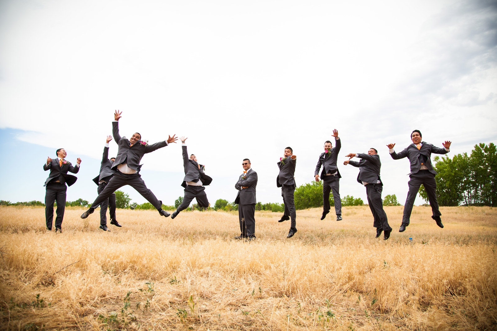 Groomsmen jumping in the air