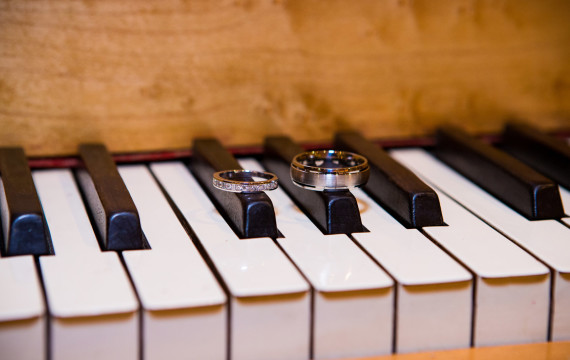 Wedding rings on piano keys
