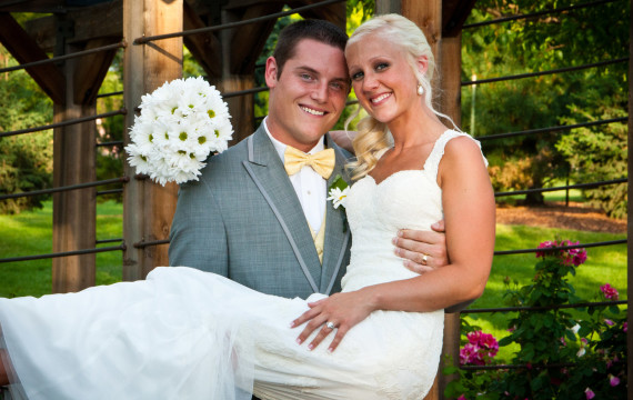 Groom holding bride at Hudson Gardens